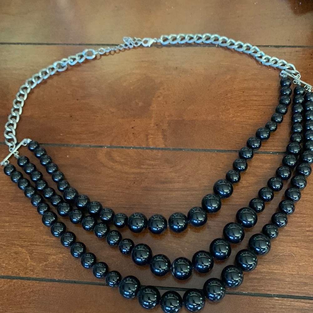Black beaded multi-strand necklace with silver colored hardware